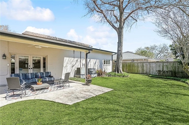 4524 Folse Dr, Metairie, LA 70006 - view of yard featuring an outdoor hangout area, a fenced backyard, french doors, a ceiling fan, and a patio