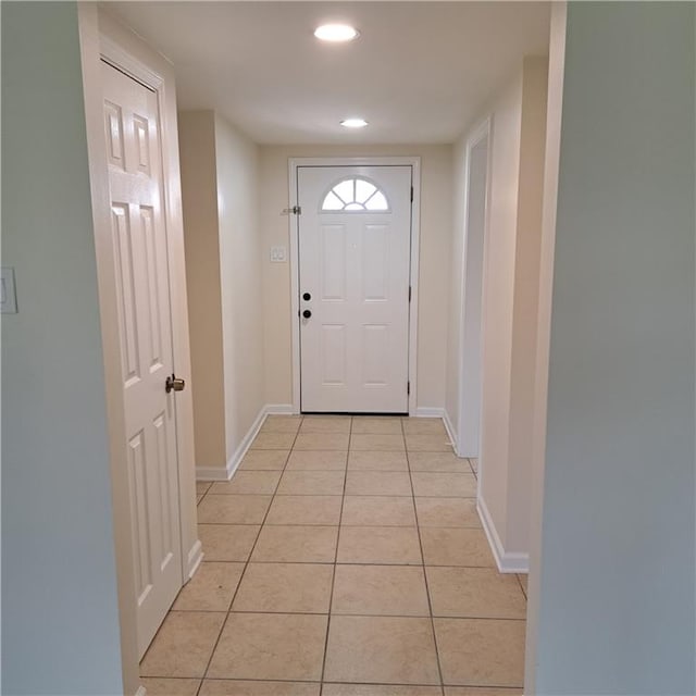 24 Caribou Ct, Metairie, LA 70003 - doorway to outside with light tile patterned floors, baseboards, and recessed lighting