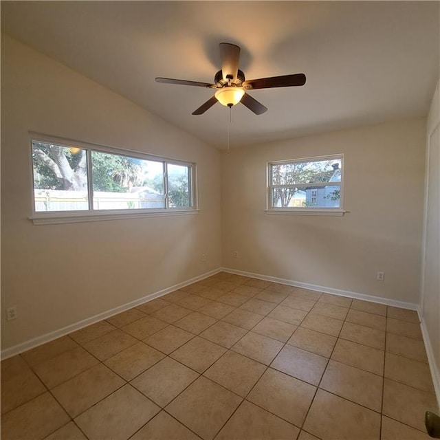 24 Caribou Ct, Metairie, LA 70003 - empty room with lofted ceiling, baseboards, light tile patterned flooring, and a ceiling fan