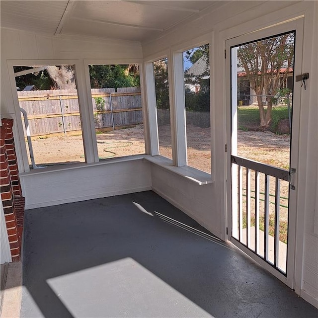 24 Caribou Ct, Metairie, LA 70003 - unfurnished sunroom with healthy amount of natural light and concrete floors