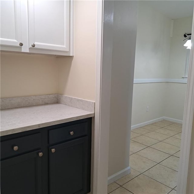 24 Caribou Ct, Metairie, LA 70003 - bar area with light tile patterned floors and baseboards