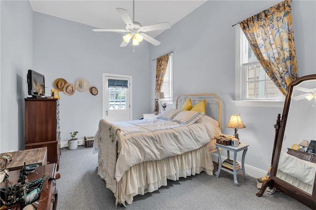 bedroom featuring baseboards, carpet flooring, and ceiling fan