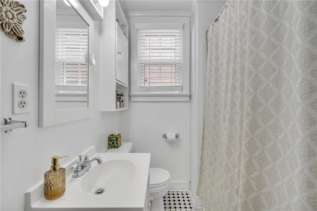 full bathroom featuring vanity, baseboards, toilet, and tile patterned flooring