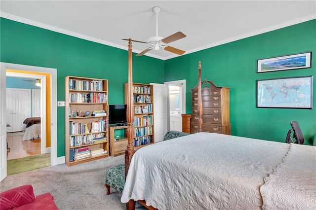 bedroom with crown molding, baseboards, carpet floors, and ceiling fan