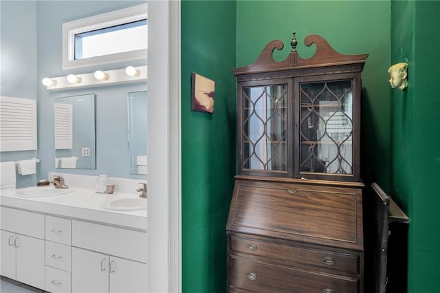 full bath featuring double vanity and a sink