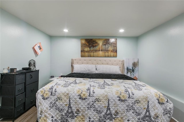 bedroom with recessed lighting and wood finished floors