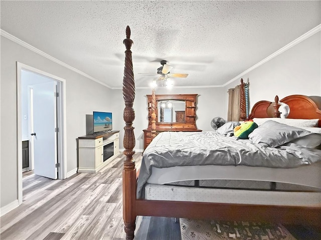 115 Spruce Cir, Slidell, LA 70458 - bedroom featuring crown molding, a textured ceiling, wood finished floors, and a ceiling fan