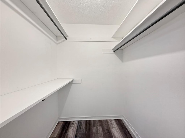 115 Spruce Cir, Slidell, LA 70458 - walk in closet featuring dark wood finished floors