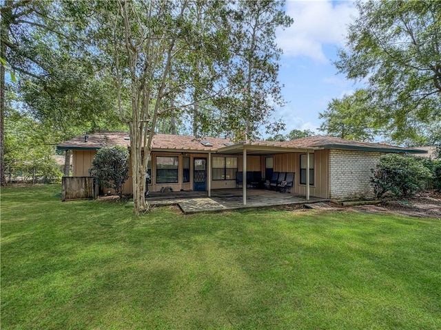 115 Spruce Cir, Slidell, LA 70458 - back of property with a patio, a yard, and board and batten siding