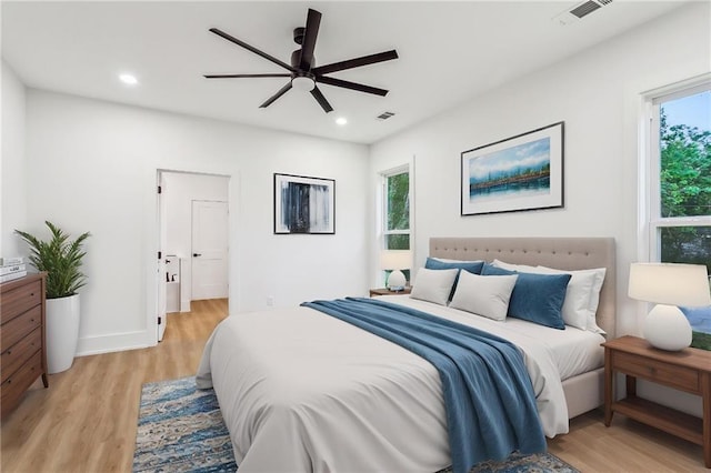 bedroom with light wood-type flooring, recessed lighting, and visible vents