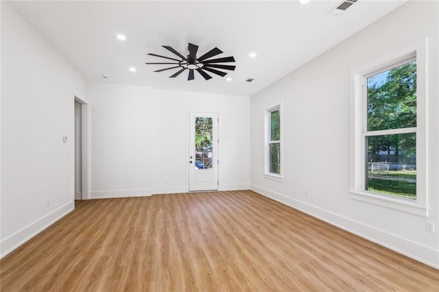 spare room with recessed lighting, baseboards, visible vents, and light wood-style flooring