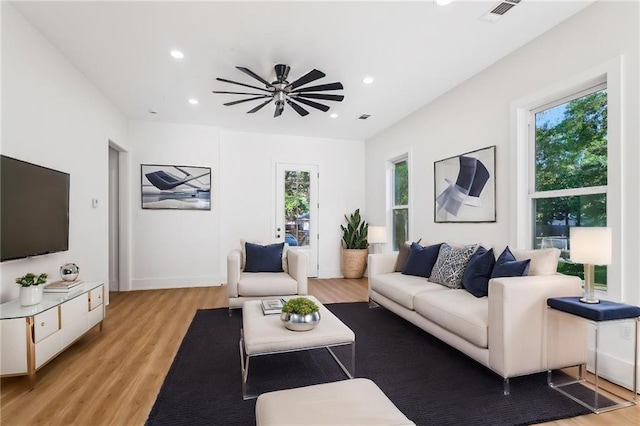 living area featuring visible vents, recessed lighting, light wood finished floors, and a ceiling fan