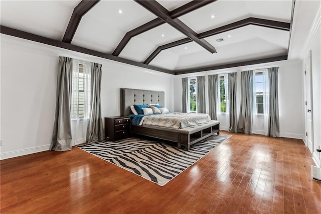 bedroom with baseboards, coffered ceiling, beam ceiling, and hardwood / wood-style floors