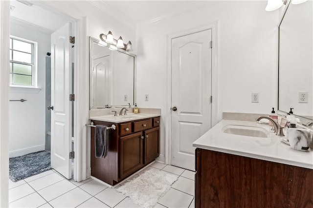 full bathroom featuring crown molding, a sink, two vanities, and tile patterned flooring