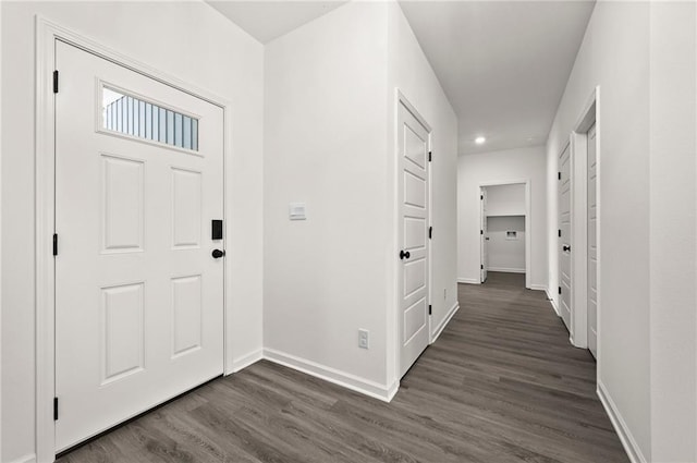 entrance foyer featuring baseboards, recessed lighting, and dark wood-style floors