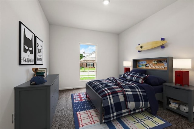 carpeted bedroom with baseboards
