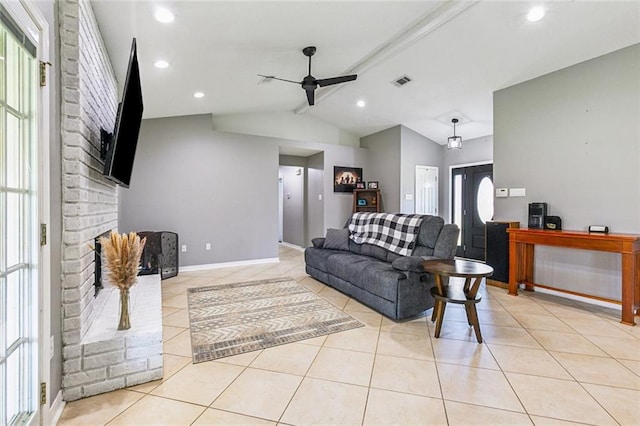 living room with a healthy amount of sunlight, visible vents, a ceiling fan, and lofted ceiling