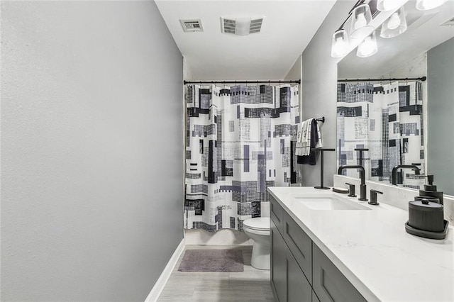 full bathroom with visible vents, a shower with shower curtain, toilet, and vanity