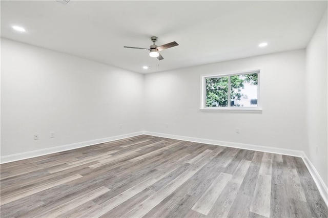 empty room featuring a ceiling fan, recessed lighting, and wood finished floors