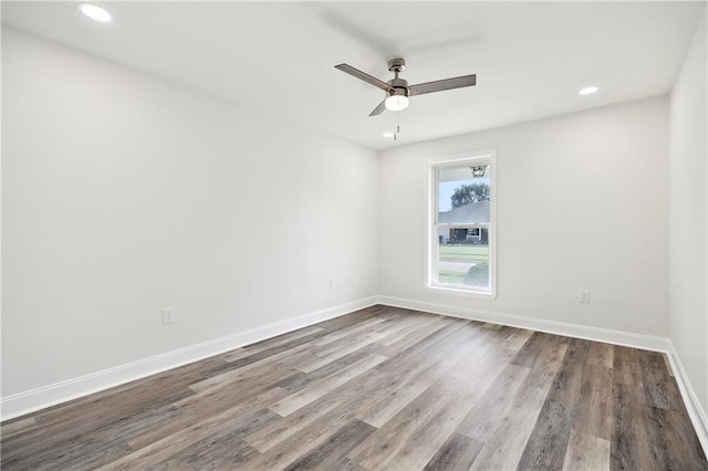 empty room featuring recessed lighting, baseboards, ceiling fan, and wood finished floors