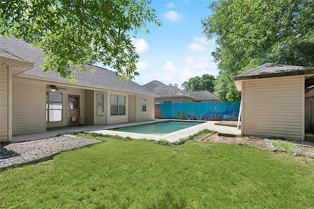 view of pool featuring a lawn, a patio, a fenced in pool, and a fenced backyard