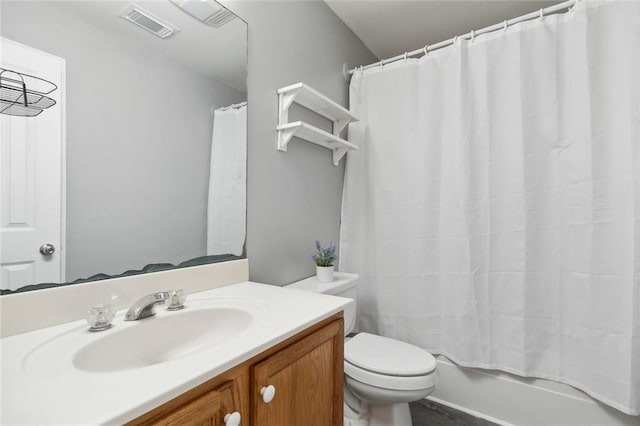 bathroom featuring visible vents, shower / tub combo with curtain, toilet, and vanity