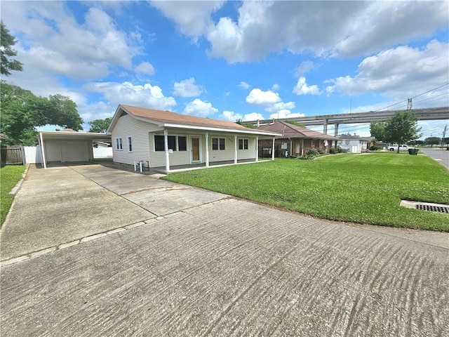 813 2nd Ave, Harvey, LA 70058 - single story home featuring a carport, fence, a front yard, and concrete driveway