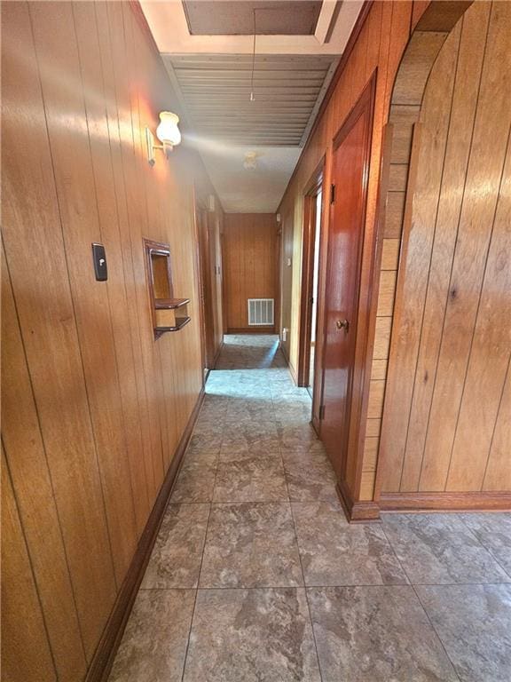 813 2nd Ave, Harvey, LA 70058 - hall with visible vents, wood walls, baseboards, and attic access