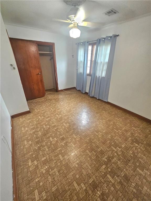 813 2nd Ave, Harvey, LA 70058 - unfurnished bedroom with a ceiling fan, baseboards, visible vents, and a closet