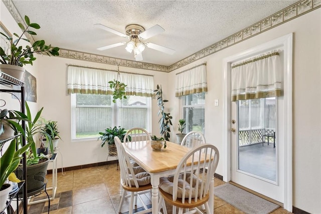 1734 Barrymore St, Slidell, LA 70461 - dining area featuring a textured ceiling, ceiling fan, and light tile patterned floors