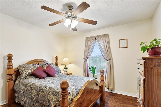 1734 Barrymore St, Slidell, LA 70461 - bedroom with a textured ceiling, baseboards, a ceiling fan, and wood finished floors