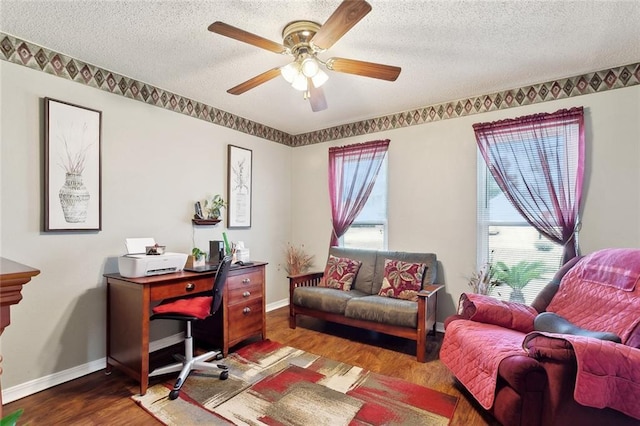 1734 Barrymore St, Slidell, LA 70461 - office area with a textured ceiling, baseboards, a ceiling fan, and wood finished floors