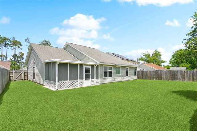 1734 Barrymore St, Slidell, LA 70461 - back of property featuring a lawn, a fenced backyard, and a sunroom