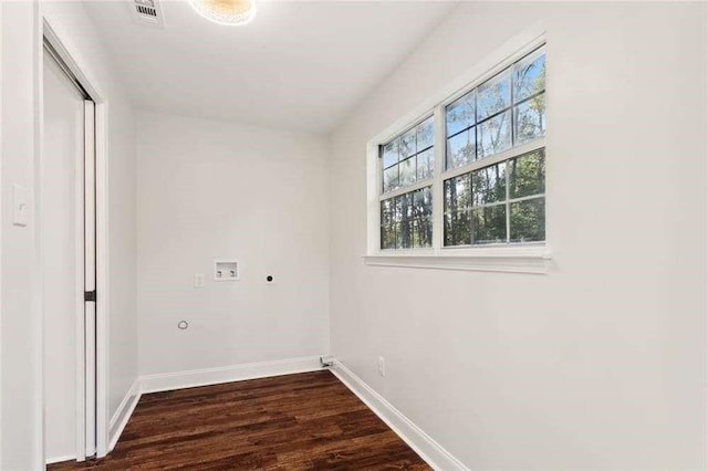 clothes washing area featuring washer hookup, laundry area, electric dryer hookup, baseboards, and dark wood-style floors