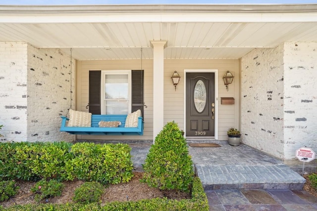 entrance to property with covered porch