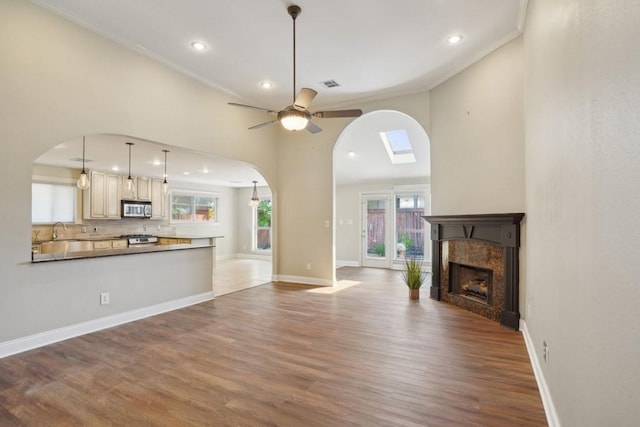 3909 Courtland St, Metairie, LA 70002 - unfurnished living room with a sink, arched walkways, and ornamental molding