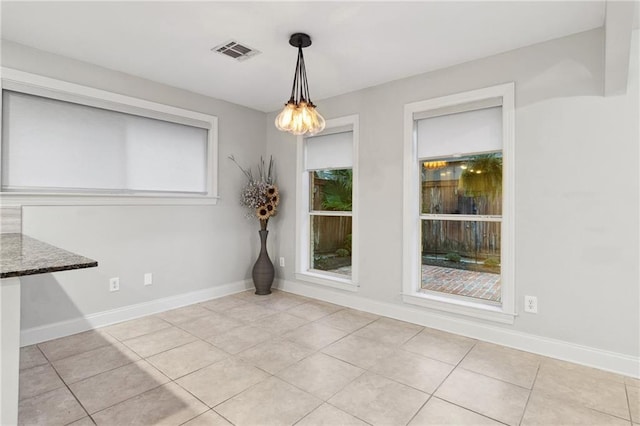 3909 Courtland St, Metairie, LA 70002 - unfurnished dining area with baseboards, visible vents, and light tile patterned floors