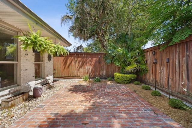 view of patio / terrace featuring a fenced backyard and entry steps