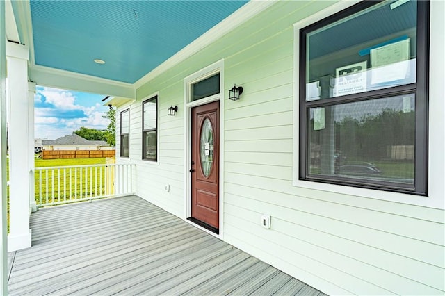 wooden terrace with a porch