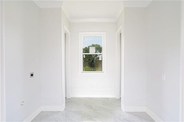 hallway featuring baseboards and ornamental molding