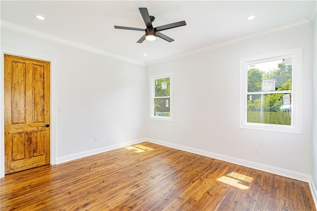 empty room with crown molding, ceiling fan, hardwood / wood-style floors, recessed lighting, and baseboards