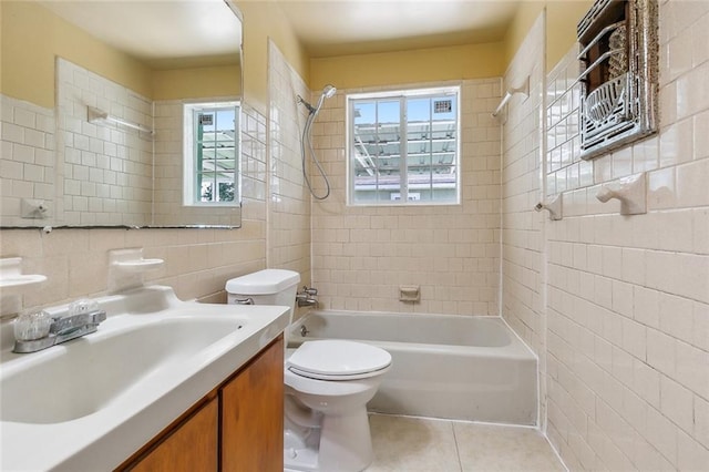 452 Maple Loop, La Place, LA 70068 - bathroom featuring toilet, tile patterned floors, tile walls, and shower / tub combination