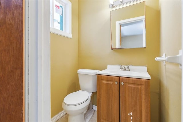 452 Maple Loop, La Place, LA 70068 - bathroom featuring vanity, baseboards, and toilet
