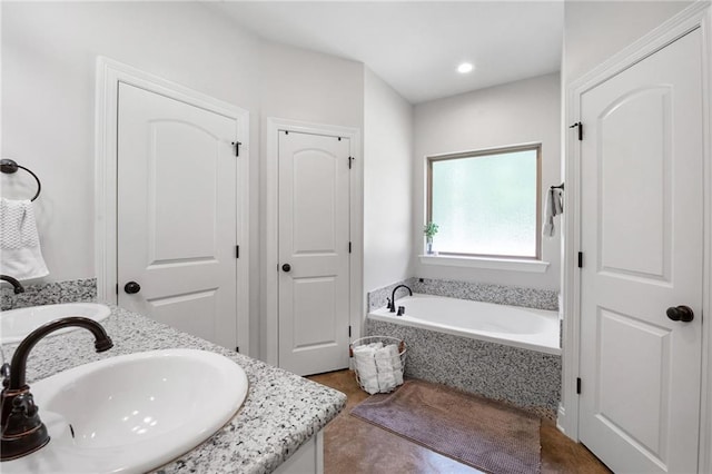 18203 Fox Hollow Loop, Hammond, LA 70401 - full bath featuring a garden tub, recessed lighting, a closet, and vanity