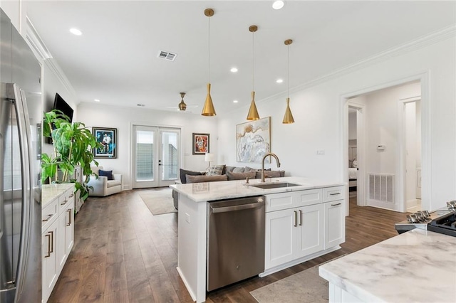 kitchen with dark wood-style flooring, a sink, french doors, stainless steel appliances, and visible vents