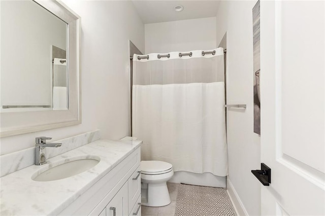 bathroom featuring vanity, shower / tub combo with curtain, tile patterned floors, and toilet