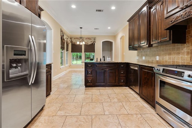 kitchen with a notable chandelier, appliances with stainless steel finishes, ornamental molding, and dark brown cabinetry