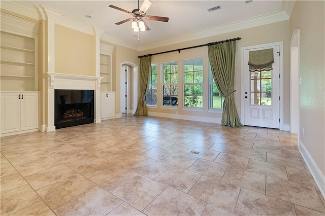 unfurnished living room featuring baseboards, ceiling fan, visible vents, and built in shelves