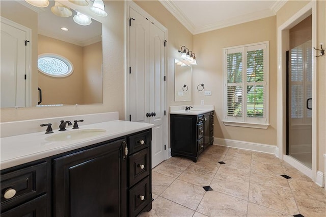 full bath with a sink, crown molding, and two vanities