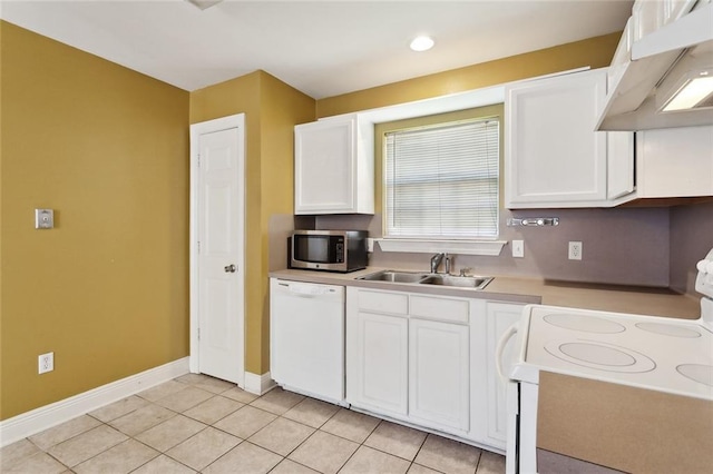 kitchen with a sink, white cabinets, under cabinet range hood, and white appliances